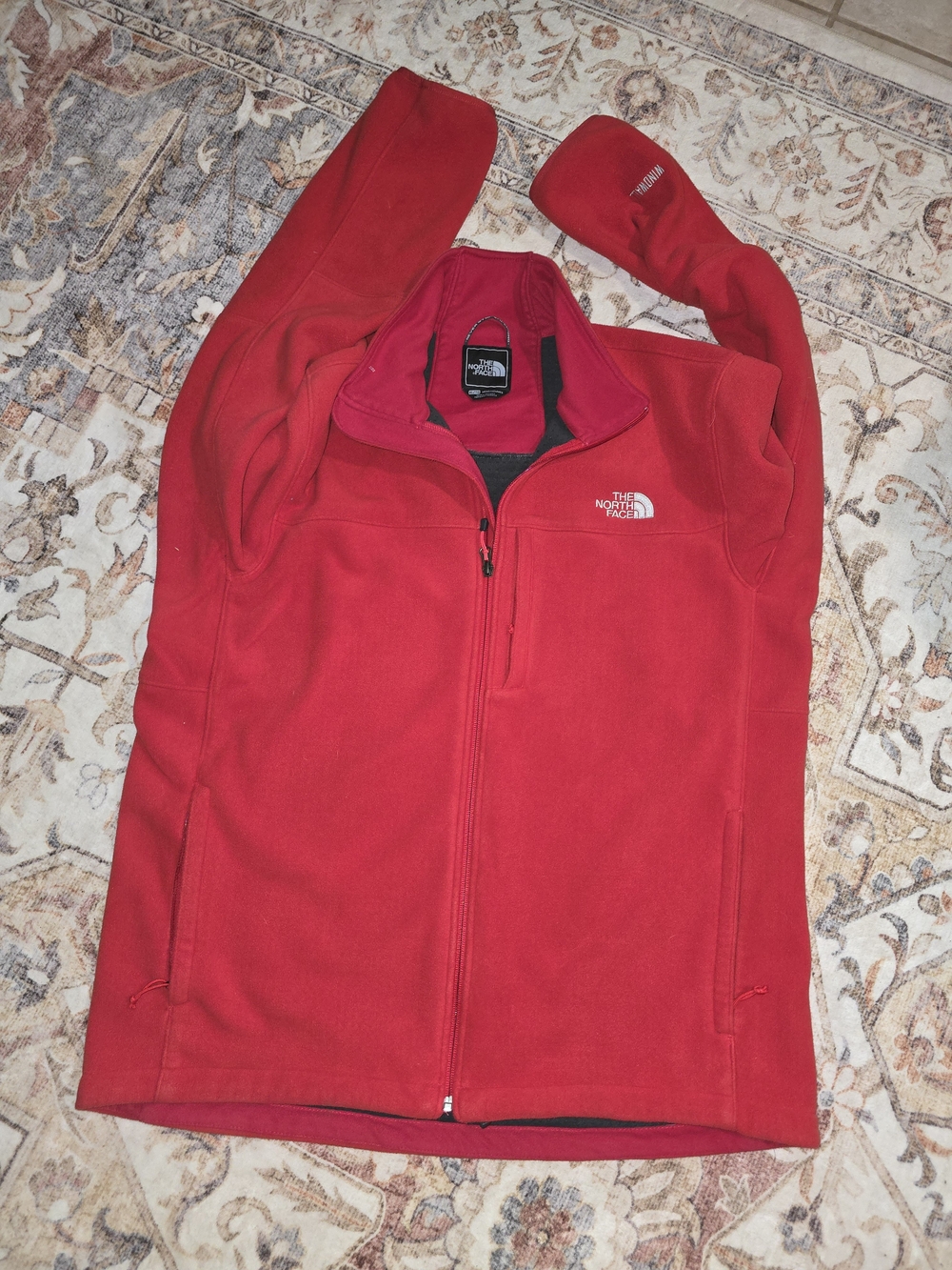 The North Face Wind Wall Red Fleece Jacket.